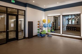 Yoga room with ballet bar